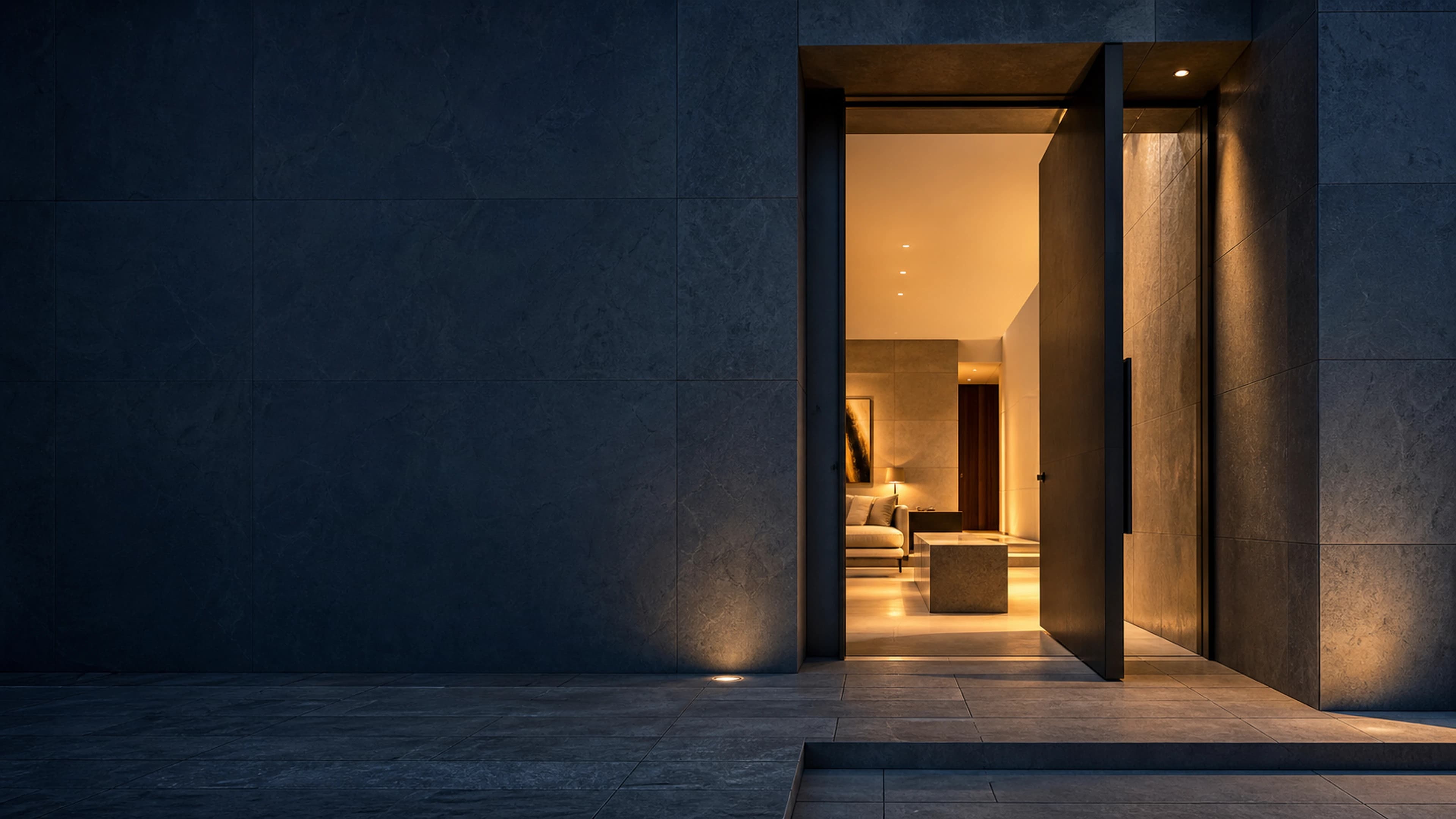An open doorway into a contemporary home at blue hour